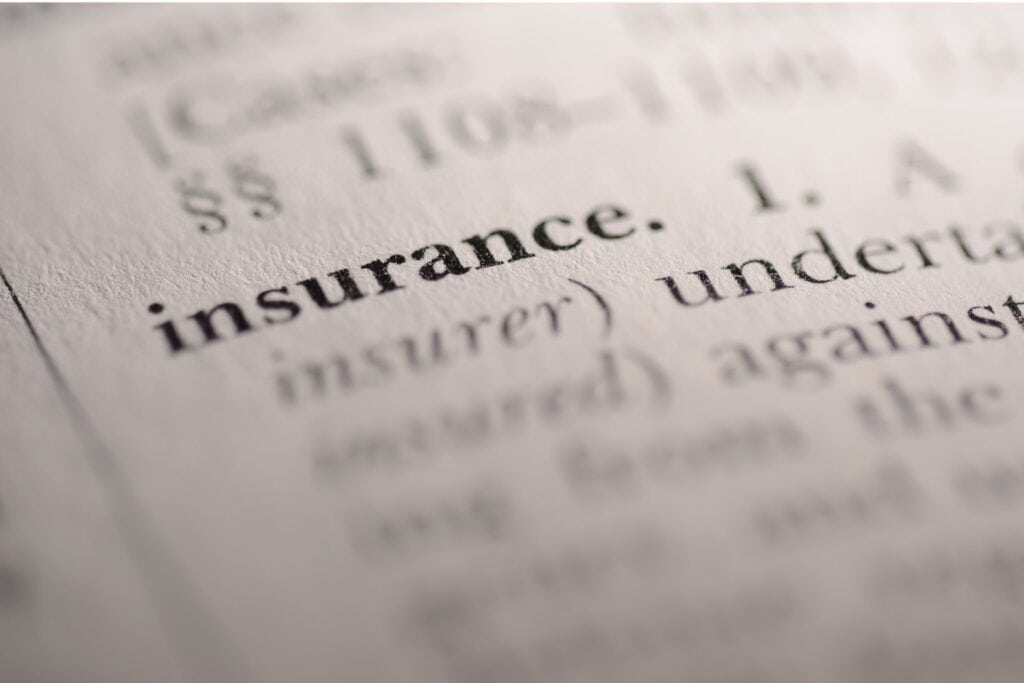 where-to-advertise-dog-walking-faqs Image of he word "insurance" in a dictionary.